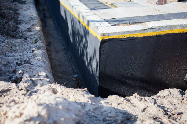 Professional Basement Waterproofing technician working in Ridgeville Corners, OH
